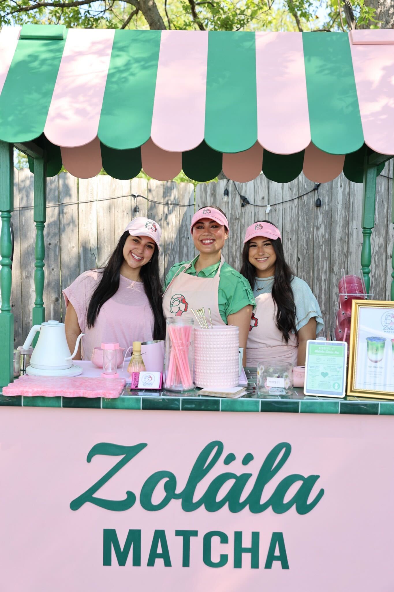 Zoläla Matcha cart serving guests at a special event with professional setup and branded decorations